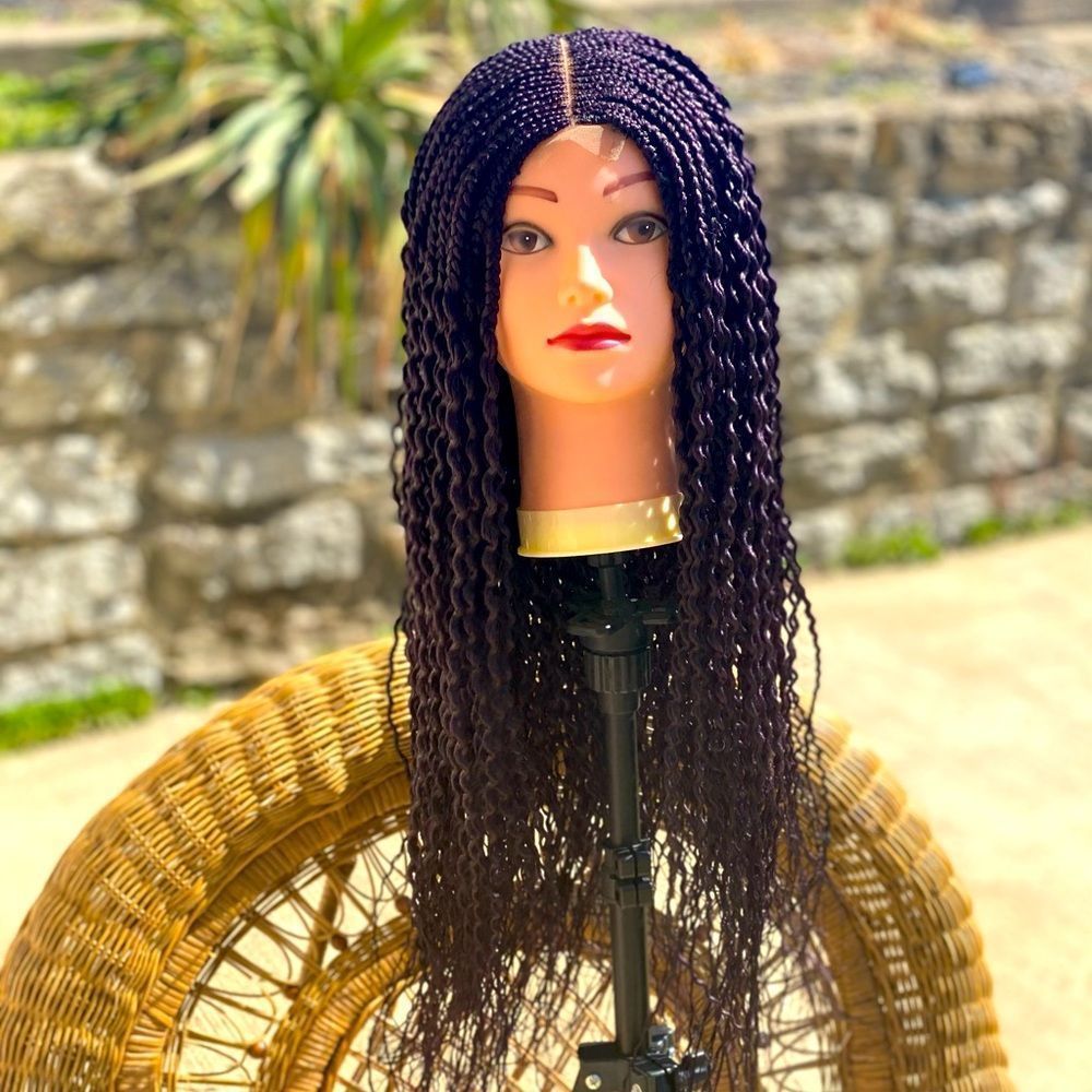 Wire curls, center parting single braids